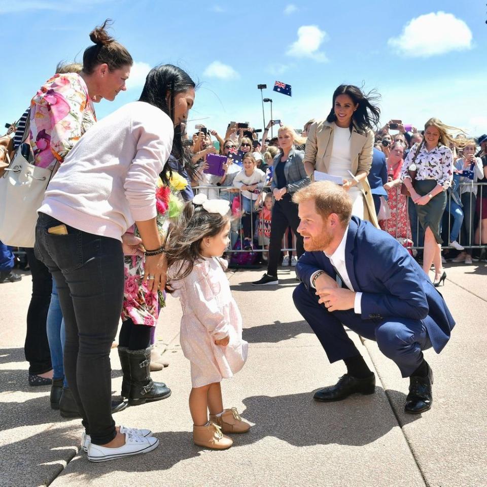 Prince Harry greeting a young fan