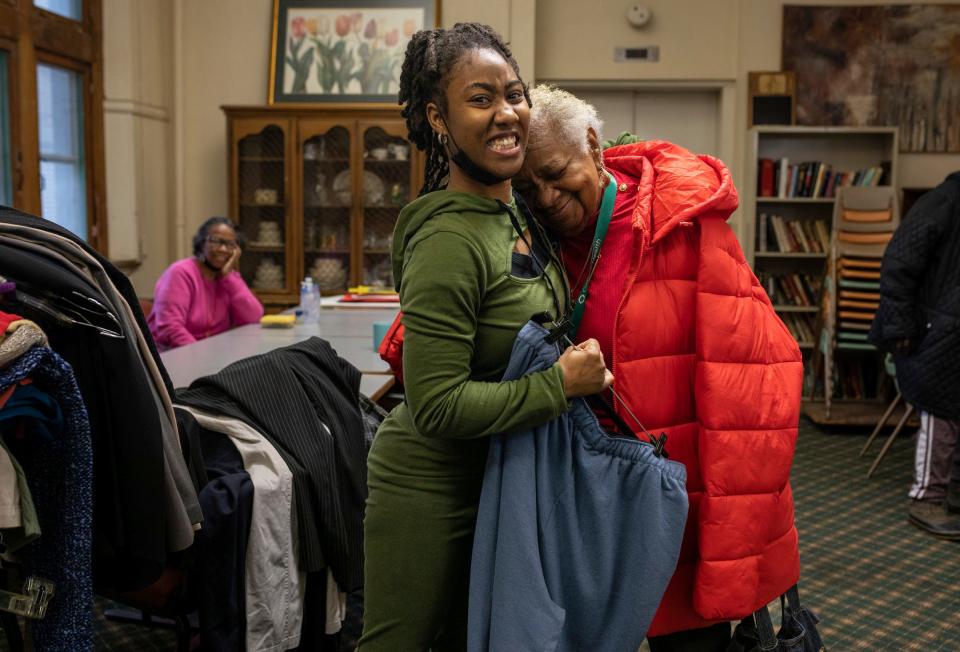 Unique Baldwin, left, a volunteer at the St. Patrick Senior Center, smiles as she gives Frances Lewis, 87, of Detroit, a hug inside the center in Detroit on Wednesday, Jan. 31, 2024.