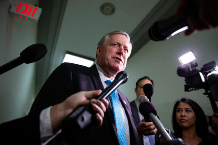 FILE PHOTO: Rep. Mark Meadows (R-NC) speaks to reporters as he arrives as former Trump campaign aide George Papadopoulos gives a voluntary, transcribed interview behind closed doors before the House Oversight and Judiciary Committee, on Capitol Hill, in Washington, U.S., October 25, 2018. REUTERS/Al Drago