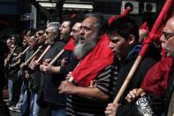 Protesters from the Communist-affiliated trade union PAME shout slogans as they march towards the parliament during a general labour strike in Athens April 9, 2014. REUTERS/Alkis Konstantinidis