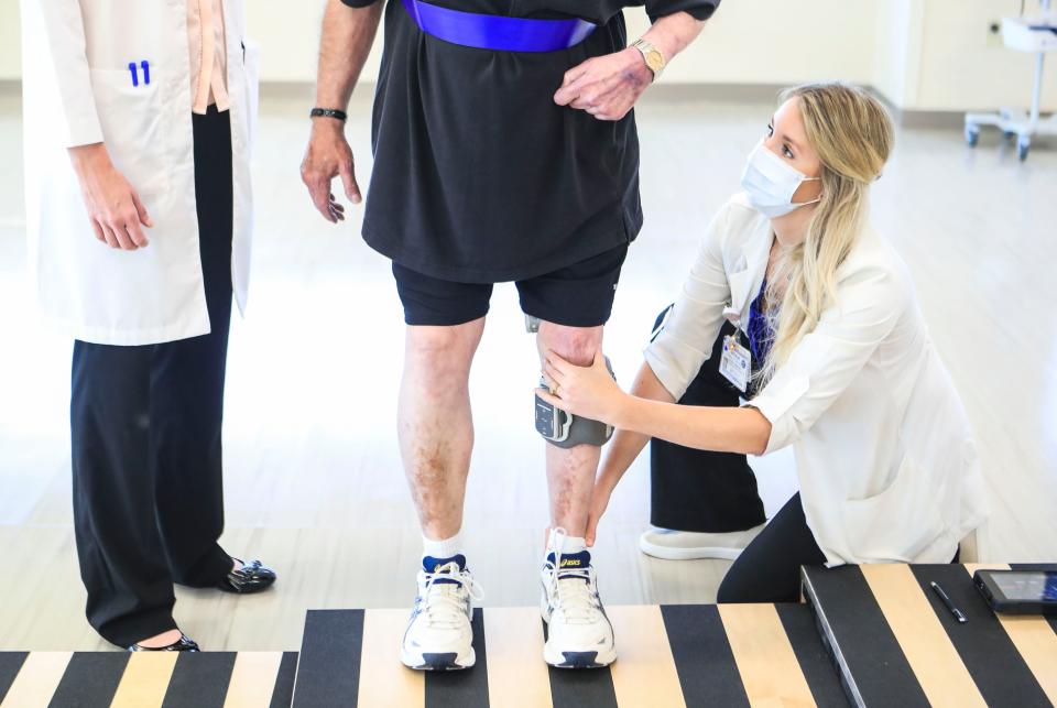 Physical therapist Natalie Vance looks up at patient Sam Weakley as his left leg has an electrical stimulator. Weakley wears it to help with gait impairment brought on by a stroke and Parkinson’s. Weakley was at therapy at the newly opened Norton Neuroscience Institute on the Norton Brownsboro Hospital Campus. Norton Healthcare invested $15 million into the 48,000-square foot space which includes clinical, diagnostic and rehabilitation areas. June 14, 2021