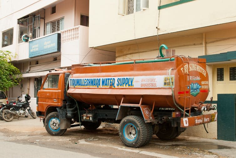 <span class="caption">A tanker delivers water in Bangalore.</span> <span class="attribution"><a class="link " href="https://www.shutterstock.com/image-photo/bangalore-india-july-15-water-tanker-82300918?src=mo_CUryeWEE4_zTPRvVnWA-1-1" rel="nofollow noopener" target="_blank" data-ylk="slk:Ajay Bhaskar/Shutterstock.;elm:context_link;itc:0;sec:content-canvas">Ajay Bhaskar/Shutterstock.</a></span>