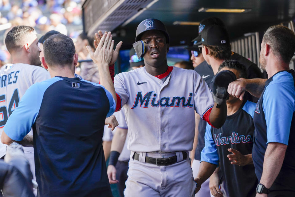 Miami Marlins' Jesus Sanchez celebrates after scoring off an RBI-single by Luke Williams during the tenth inning of a baseball game against the New York Mets, Sunday, July 10, 2022, in New York. (AP Photo/Mary Altaffer)