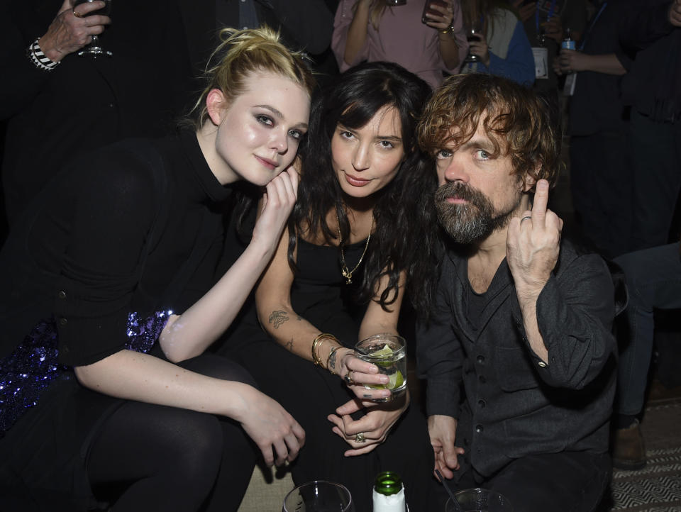 Actress Elle Fanning, left, director Reed Morano and Peter Dinklage attend the “I Think We’re Alone Now” cast party at Chase Sapphire on Main on Sunday, Jan. 21, 2018, in Park City, Utah. (Photo by Evan Agostini/Invision for Chase Sapphire/AP Images)