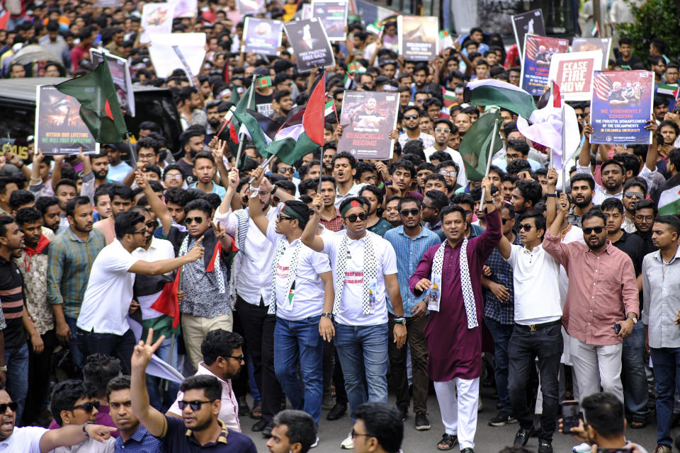 Bangladeshi students wave Palestinian flags, as they march during a pro- Palestinian demonstration at the Dhaka University area in Dhaka, Bangladesh, Monday, May 6, 2024. (AP Photo/ Mahmud Hossain Opu )