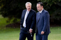 FILE - White House social media director Dan Scavino, right, and White House chief of staff Mark Meadows, left, walk to board Marine One with President Donald Trump on the South Lawn of the White House, Tuesday, Sept. 22, 2020, in Washington. According to a person familiar with a letter sent by the Justice Department to a lawyer for the House of Representatives on Friday, June 3, 2022, the Justice Department has declined to charge former White House chief of staff Meadows and Scavino for contempt of Congress for their defiance of subpoenas in the Jan. 6 congressional investigation. (AP Photo/Andrew Harnik, File)
