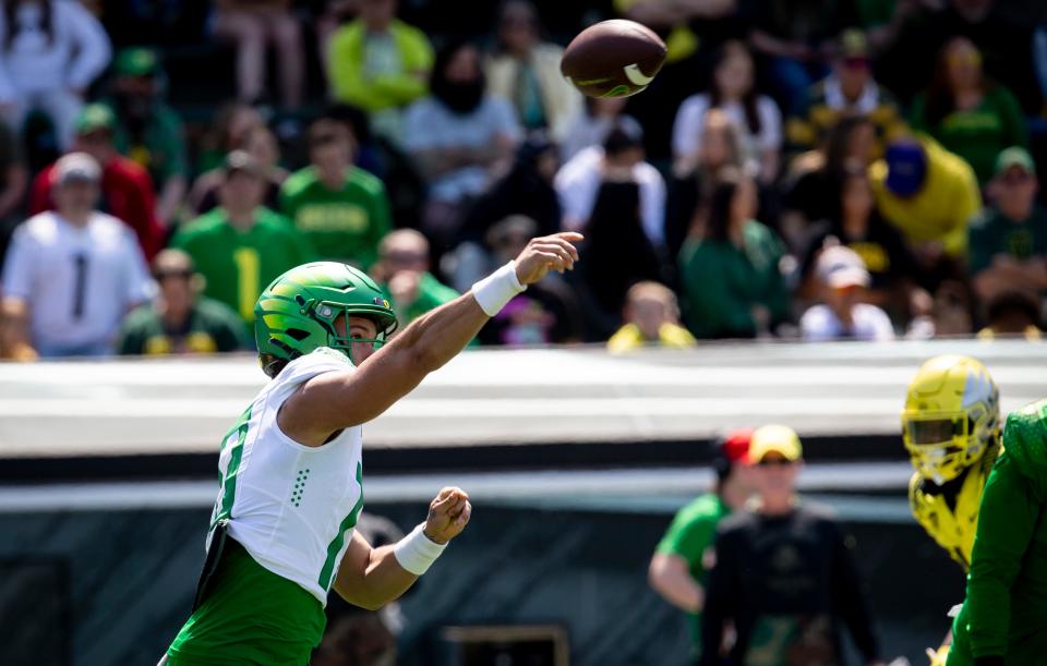 Green Team quarterback Ty Thompson (13) throws out a pass during the second quarter of the Oregon Spring Game Saturday, April 23, 2022. 