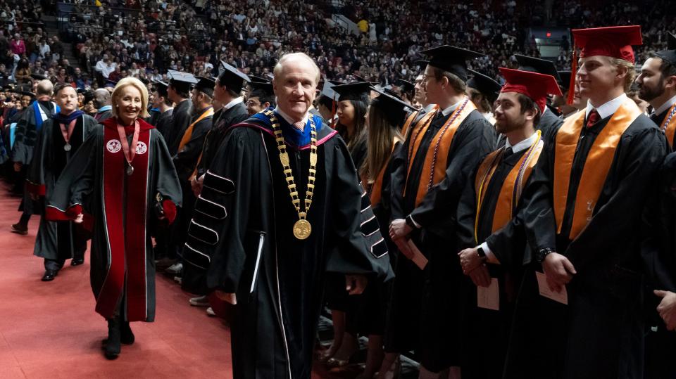 The University of Alabama presented more than 2,100 degrees during the Fall 2023 Commencement Saturday, Dec. 16, 2023, in Coleman Coliseum. President Stuart Bell leads the platform party as they enter the arena.