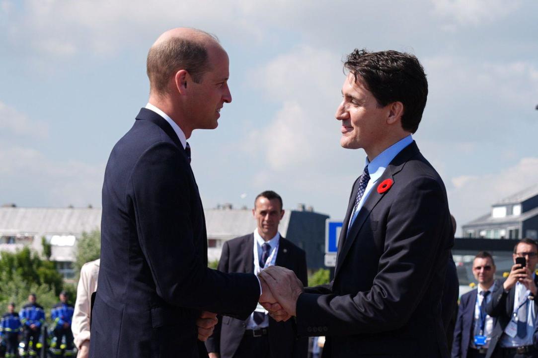 The Prince of Wales is greeted by Canadian Prime Minister Justin Trudeau, ahead of the Government of Canada ceremony to mark the 80th anniversary of D-Day, at Juno Beach in Courseulles-sur-Mer, Normandy, France. Picture date: Thursday June 6, 2024.