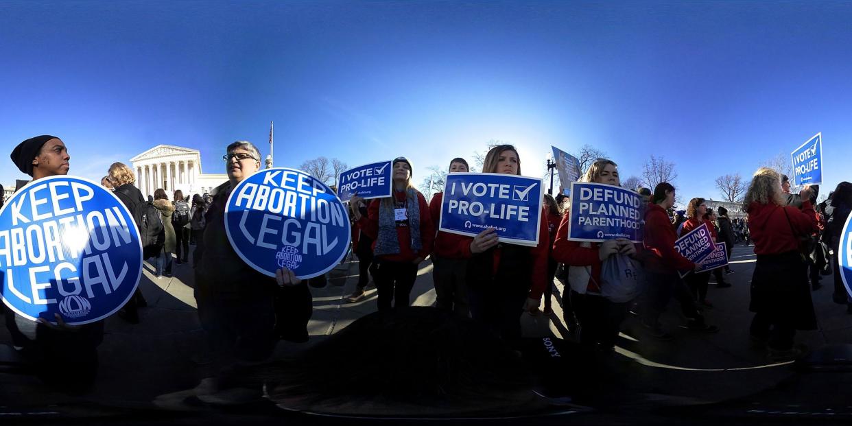 Anti-abortion activists hold signs as they counter-protest in front of the U.S. Supreme Court during the 2018 March for Life January 19 2018 in Washington DC (Alex Wong/Getty)