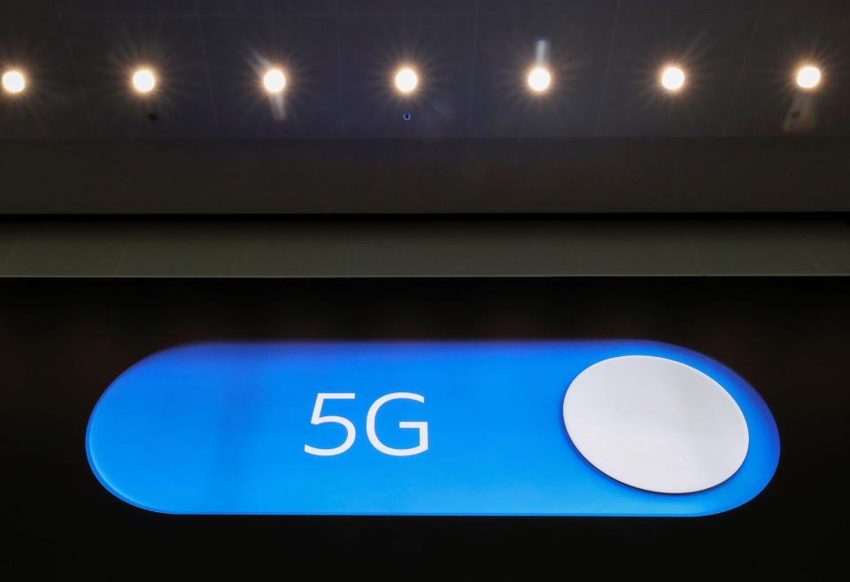 FILE PHOTO: An advertising board shows a 5G logo at the International Airport in Zaventem, Belgium May 4, 2020. Picture taken May 4, 2020. REUTERS/Yves Herman