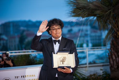 <span class="caption">Parasite's director Bong Joon-ho with the Palme d'Or award at Canne, 2019</span> <span class="attribution"><a class="link " href="https://www.shutterstock.com/image-photo/cannes-france-may-25-2019-south-1409664518" rel="nofollow noopener" target="_blank" data-ylk="slk:Tania Volobueva/Shutterstock;elm:context_link;itc:0;sec:content-canvas">Tania Volobueva/Shutterstock</a></span>