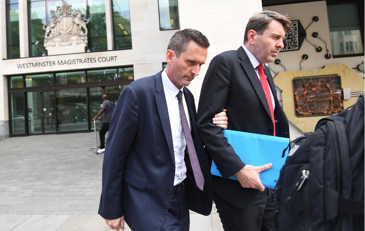 Lord Holmes of Richmond (left) leaves Westminster Magistrates' Court, London where he appeared on charges of sexual assault.