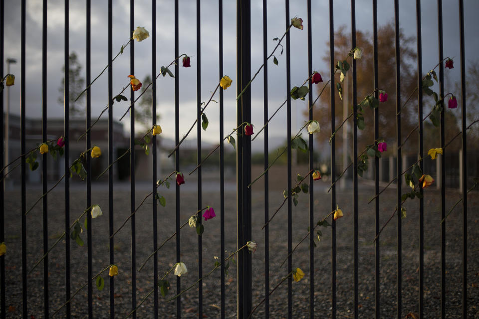 FILE - In this Dec. 11, 2015, file photo, roses adorn a makeshift memorial near the Inland Regional Center in San Bernardino, Calif. A radicalized couple carried out the attack on Dec. 2, against the husband’s co-workers at a holiday party, killing 14. (AP Photo/Jae C. Hong, File)