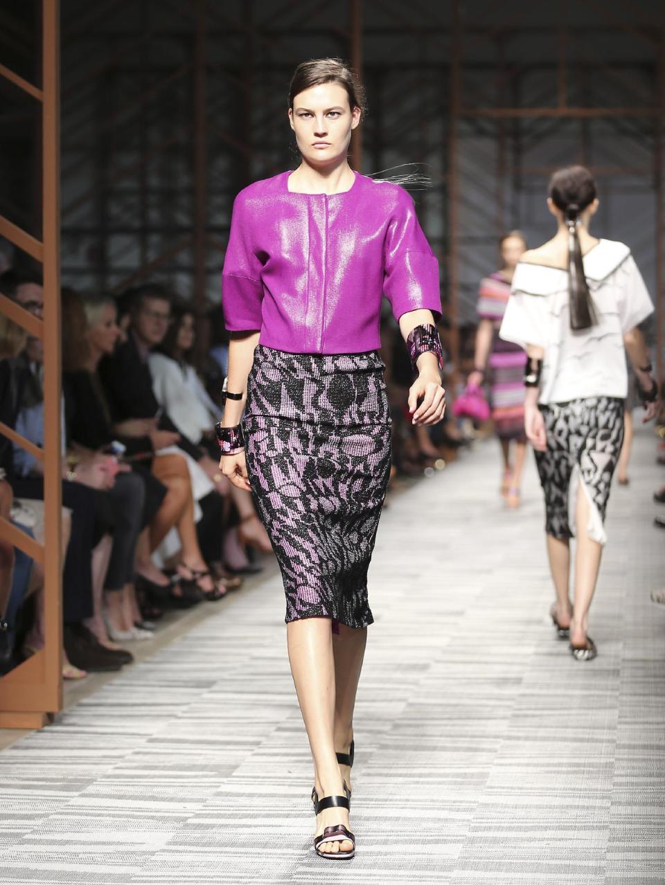 FILE - In this Sept. 22, 2013 file photo, a model wears a creation for Missoni women's Spring-Summer 2014 collection, part of the Milan Fashion Week, unveiled in Milan, Italy. Orchid is growing on us: A version of the purple hue is Pantone Inc.’s color of the year for 2014. (AP Photo/Antonio Calanni, File)
