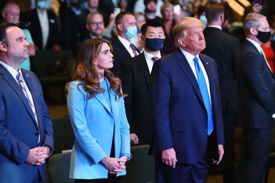 Hope Hicks, senior adviser to the president, and White House Deputy Chief of Staff for Communications Dan Scavino(L) attend services with US President Donald Trump at the International Church of Las Vegas in Las Vegas, Nevada, on October 18, 2020.  (AFP via Getty Images)