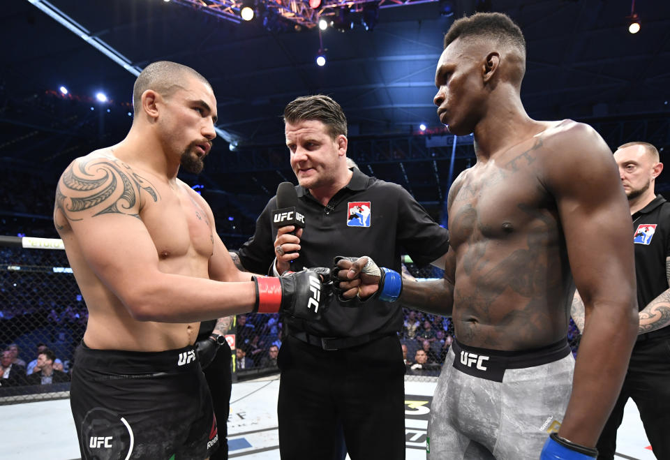 MELBOURNE, AUSTRALIA - OCTOBER 06:  (L-R) Robert Whittaker of New Zealand and Israel Adesanya of Nigeria face off prior to their UFC middleweight championship fight during the UFC 243 event at Marvel Stadium on October 06, 2019 in Melbourne, Australia. (Photo by Jeff Bottari/Zuffa LLC/Zuffa LLC via Getty Images)