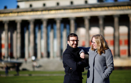 Daniela, 37, a Berlin-born social educator, and her partner Arda, 39, a German architect with Turkish roots, pose in front of Altes Museum in Berlin, Germany, February 4, 2018. "I saw Arda in 2015 at an exhibition at the museum. And he recognised me as well. A smile from both sides. One hour later we were sitting together and having a cup of coffee. Now we live together in a nice flat," said Daniela. REUTERS/Hannibal Hanschke