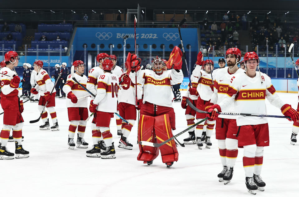 Team China players react during the men's ice hockey preliminary round Group A match between Team China and Team United States at the Beijing 2022. (Wang Xianmin/CHINASPORTS/VCG via Getty Images)