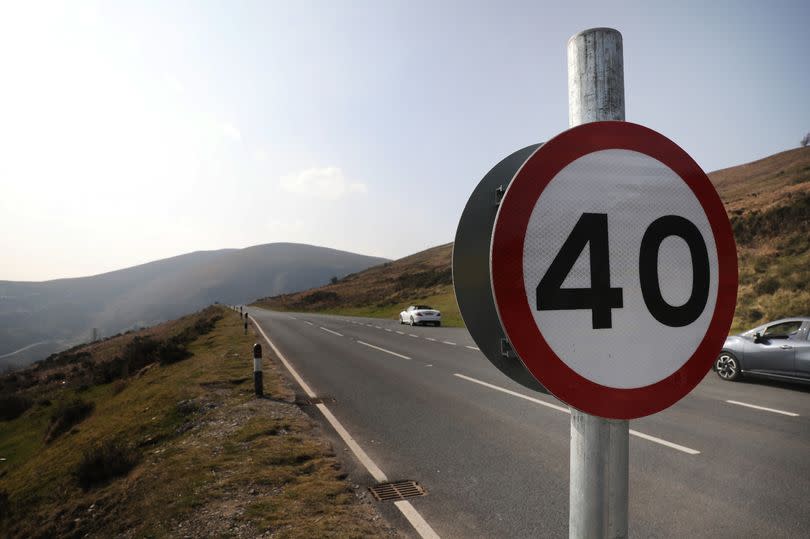 40mph speed restrictions have been introduced on a road that passes along steep hillsides with no crash barriers