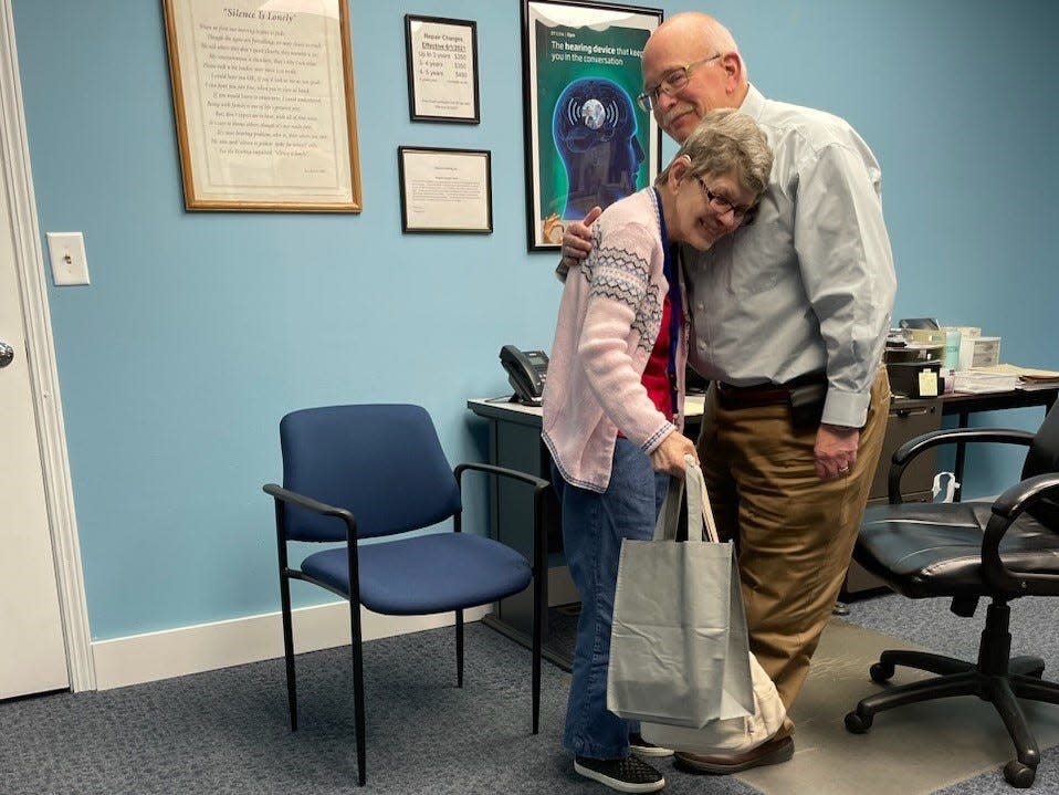 Elm House resident JoAnn Beddow hugs audiologist Elliot Sells from Precious Hearing after getting new hearing aids that restored much of her hearing.