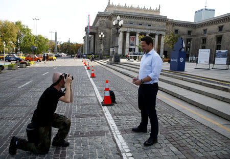 Rafal Trzaskowski, Civic Coalition (Civic Platform (Platforma Obywatelska) and Modern (Nowoczesna) coalition) candidate for mayor of Warsaw, poses for a picture in front of the Palace of Culture in Warsaw, Poland September 18, 2018. REUTERS/Kacper Pempel/File Photo