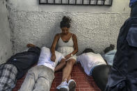 <p>During a military police operation in Hato de Enmedio neighbourhoood in Tegucigalpa, Honduras. Young boys and girls, allegedly belonging to the 18th street gang, or Mara-18, lie on the floor while the police search their house before being escorted away. (Photo: Francesca Volpi) </p>