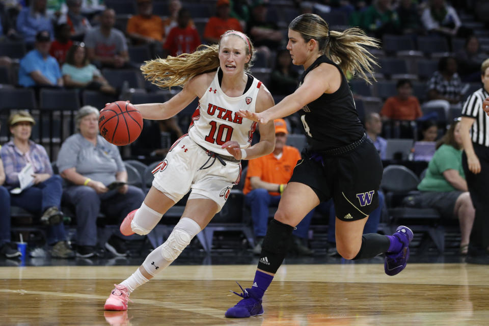 Utah's Dru Gylten (10) drives around Washington's Amber Melgoza during the second half of an NCAA college basketball game in the first round of the Pac-12 women's tournament Thursday, March 5, 2020, in Las Vegas. (AP Photo/John Locher)