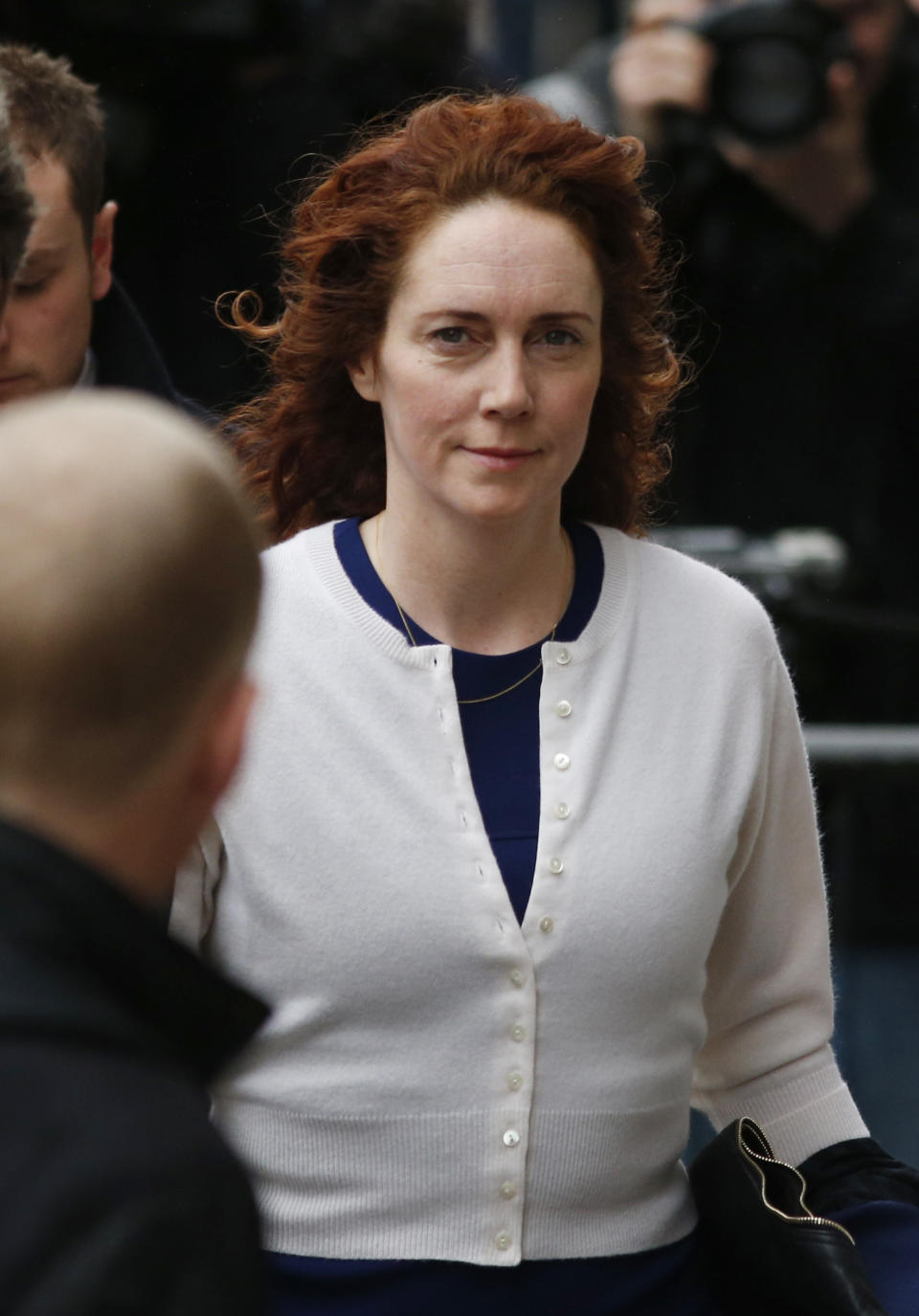 Rebekah Brooks, right, former News International chief executive, arrives at the Central Criminal Court in London where she appears to face charges related to phone hacking, Thursday, Feb. 20, 2014. (AP Photo/Lefteris Pitarakis)