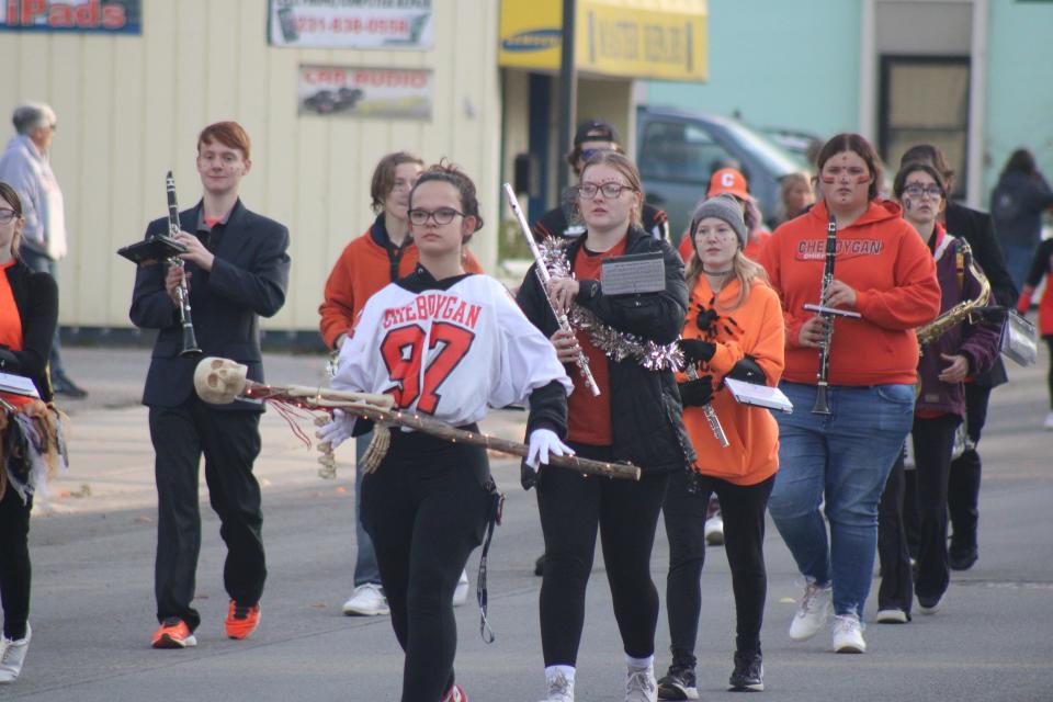 Members of the Cheboygan High School marching band make their way down Main Street during Friday's Homecoming parade.