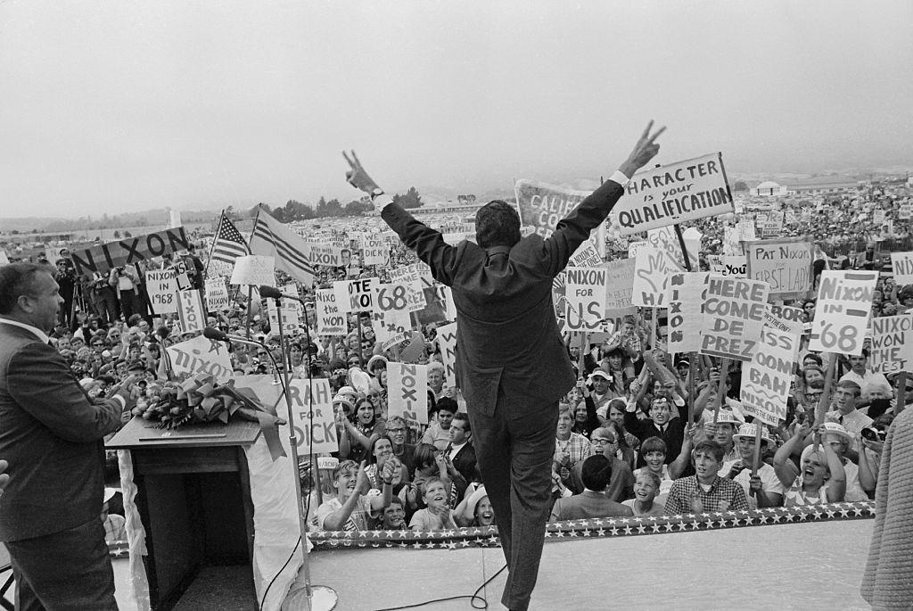 Thompson’s muse, Republican presidential hopeful Richard M. Nixon makes the “V” for victory sign to an enormous crowd of supporters ahead of the 1968 election. (Credit: Bettmann/CORBIS/Bettmann Archive via Getty Images)