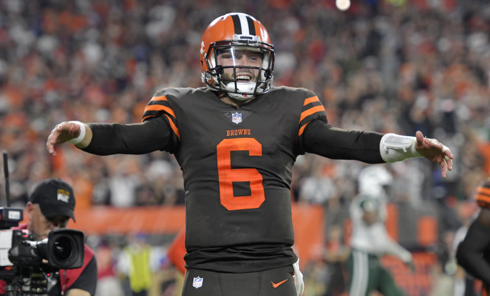 Cleveland Browns quarterback Baker Mayfield celebrates a 1-yard touchdown by running back Carlos Hyde during the second half of an NFL football game against the New York Jets, Thursday, Sept. 20, 2018, in Cleveland. The Browns won 21-17. (AP Photo/David Richard)