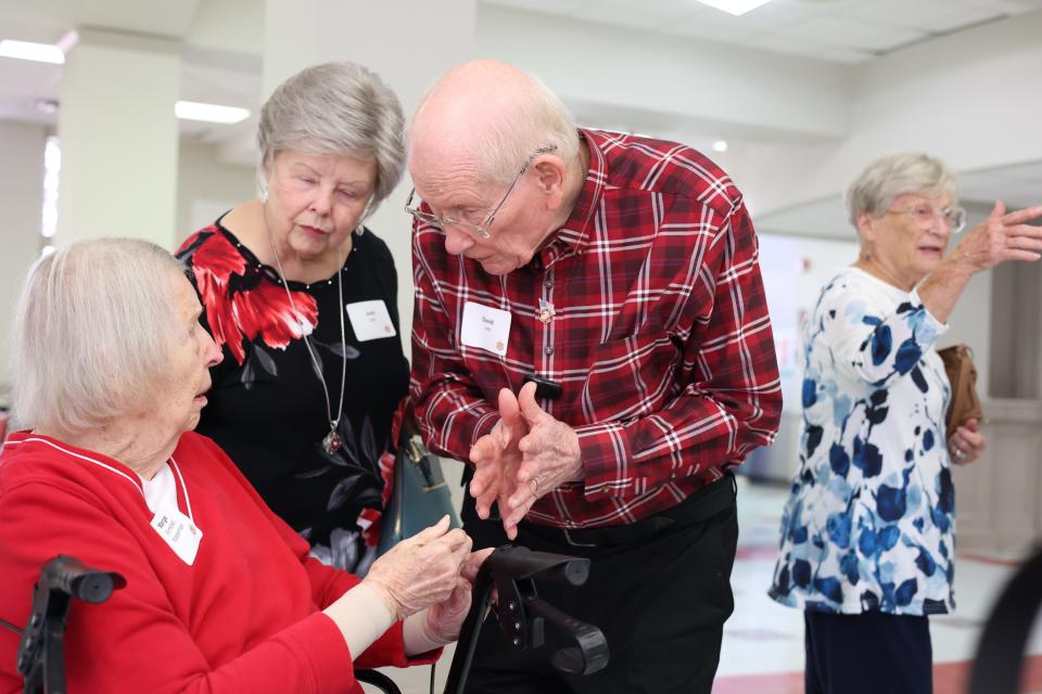 David Lee speaks to Marge Masterman at a Leon High School reunion for the class of 1951 Saturday, Sept. 17, 2022.