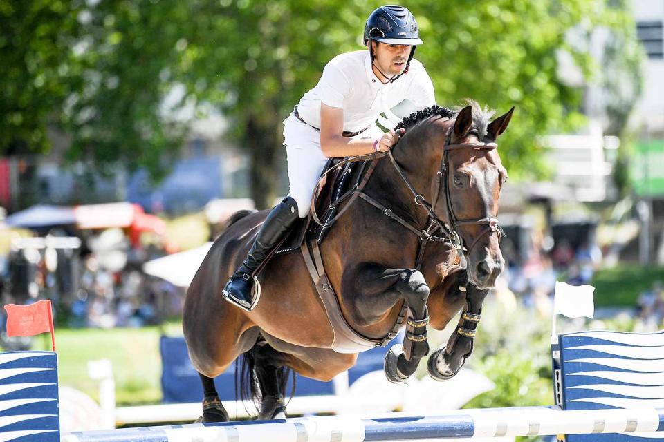 26 July 2019, Berlin: Equestrian sports/jumping: Global Champions Tour: Nayel Nassar on the horse Lucifer V jumps over an obstacle during the opening jump.