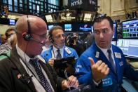 Traders work on the floor of the New York Stock Exchange shortly after the opening bell in New York August 26, 2015. REUTERS/Lucas Jackson