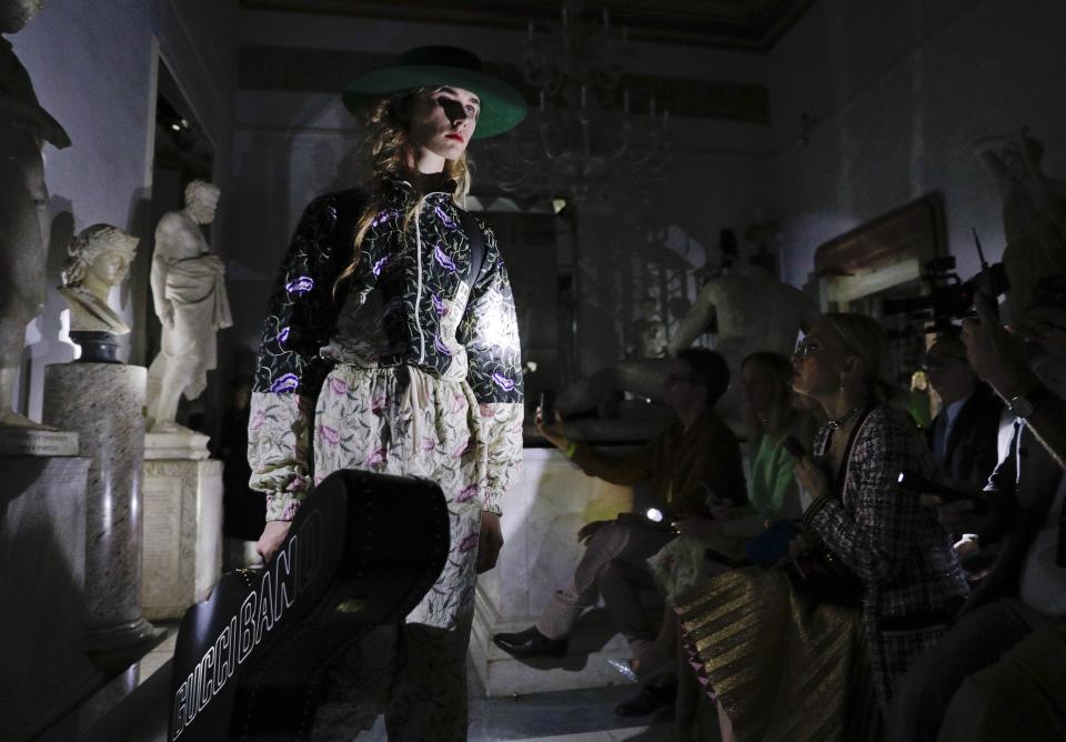 A model wears a creation as part of the Gucci cruise collection that was presented at the Capitoline Museums in Rome, Tuesday, May 28, 2019. (AP Photo/Andrew Medichini)