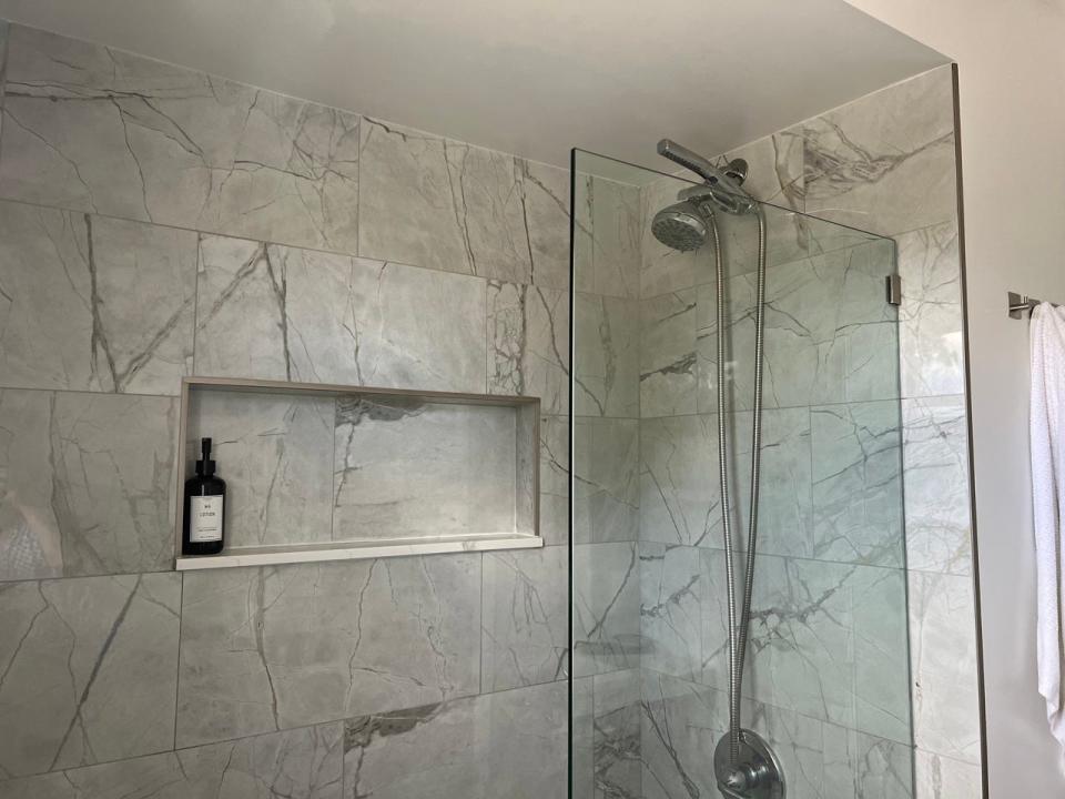 marble bathroom with cut-out for storage 