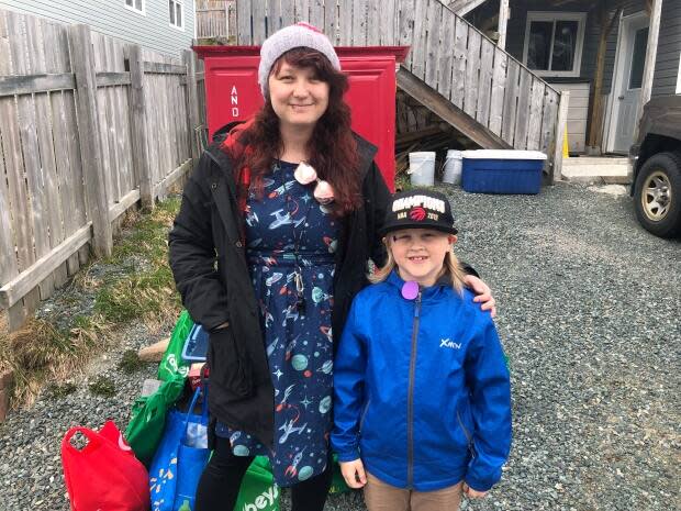 St. John Bosco Grade 3 teacher Jodi Rossiter and student Sam Peddle took part in the Little Free Pantry project. (Jeremy Eaton/CBC - image credit)