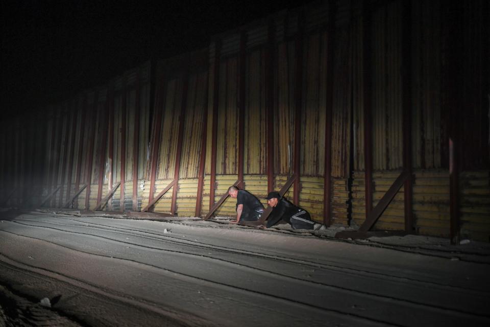 SAN LUIS, Ariz. –As day turns to night, U.S. Border Patrol Agent Jose Garibay drives his SUV east along the southern border wall, his lights turned off so spotters on the Mexican side can’t see his vehicle. When he realized two men were crouched low on the U.S. side of the border, he shined his lights on them.