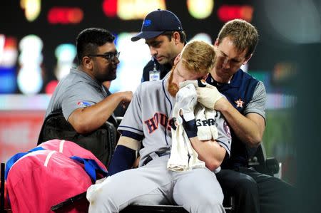 Jul 22, 2017; Baltimore, MD, USA; Houston Astros third baseman Colin Moran (19) gets carted off the field after fouling a ball off his face in the sixth inning against the Baltimore Orioles at Oriole Park at Camden Yards. Evan Habeeb-USA TODAY Sports