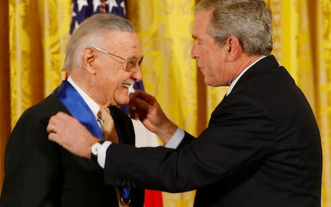 Bush and Stan Lee - Credit: AP