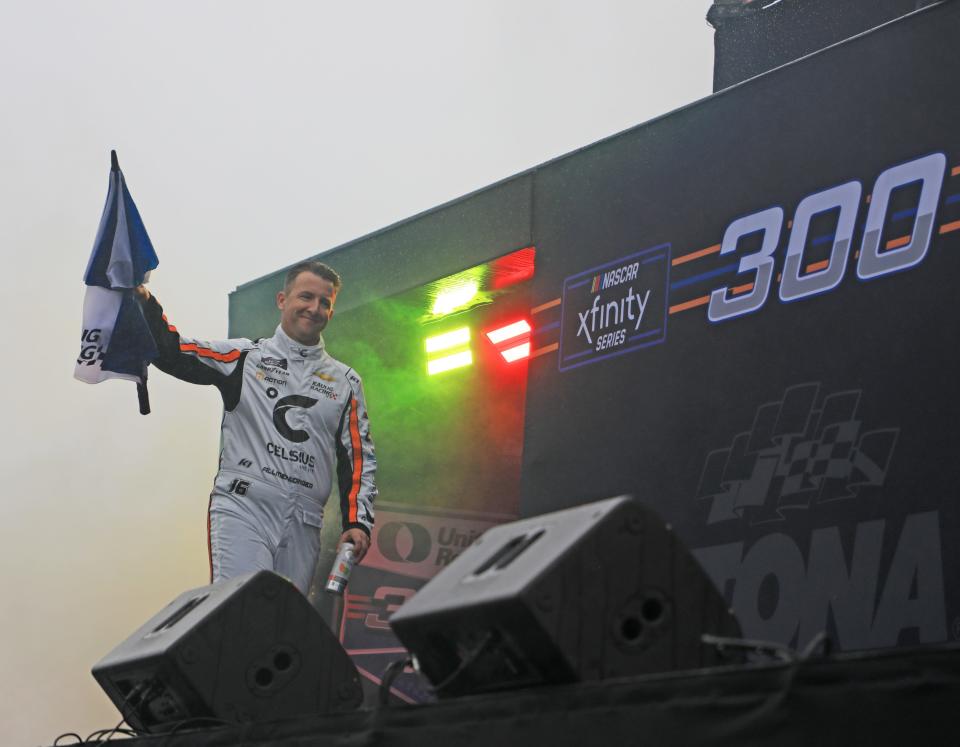 AJ Allmendinger walks out during the NASCAR Xfinity Seriese driver introductions for the United Rentals 300, Saturday, February 17, 2024 as a light rain falls on Daytona International Speedway.