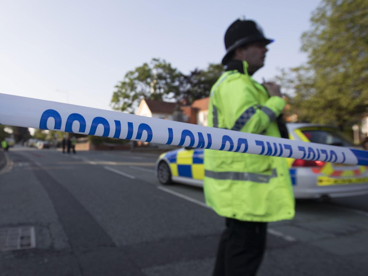 A police cordon in place near Springfield Street during the first operation on Thursday, 25 May: AFP