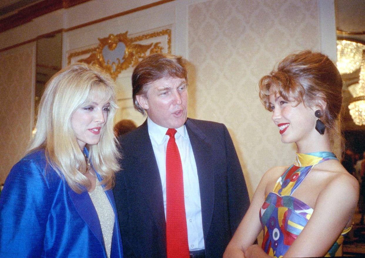 Marla Maples, left, and Donald Trump greet Jelena Mrdjen, a contestant from Yugoslavia in the Look of the Year contest at a reception in New York, on Aug. 30, 1991.