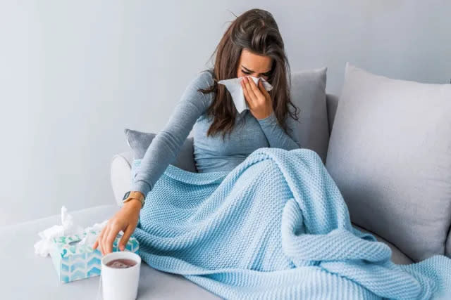 Sick woman on couch