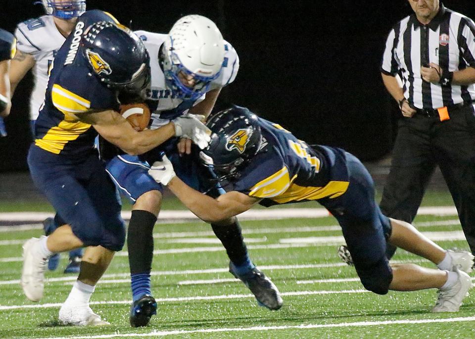 Chippewa High School's Christian Moyer (14) is tackled by Hillsdale High School's Ethan Goodwin (4) and Max Vesper (14) during high school football action Friday, Sept. 22, 2021 at Hillsdale High School. TOM E. PUSKAR/TIMES-GAZETTE.COM