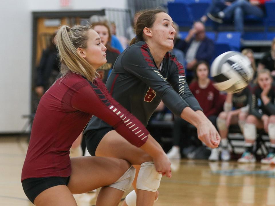 Watterson's Callie Kasun (1) and Clara Vondran (6) collide as they try to reach a shot by Dublin Jerome during a Division I regional semifinal Nov. 3 at Hilliard Darby. The Eagles won 25-11, 25-23, 25-22.