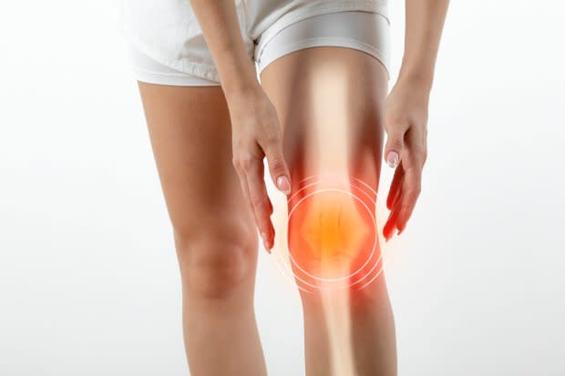 Woman suffering from pain in knee