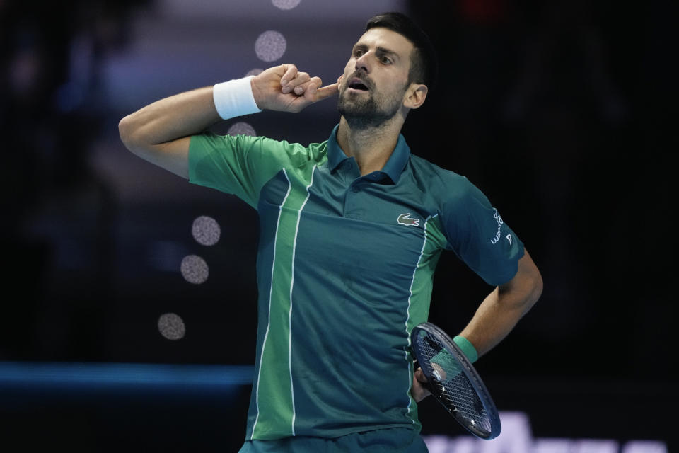 Serbia's Novak Djokovic reacts during his singles semifinal tennis match against Spain's Carlos Alcaraz of the ATP World Tour Finals at the Pala Alpitour, in Turin, Italy, Saturday, Nov. 18, 2023. (AP Photo/Antonio Calanni)