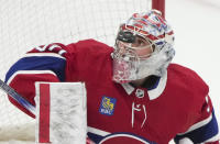 Montreal Canadiens goaltender Cayden Primeau watches the puck during the second period of the team's NHL hockey game against the Detroit Red Wings on Tuesday, April 16, 2024, in Montreal. (Christinne Muschi/The Canadian Press via AP)